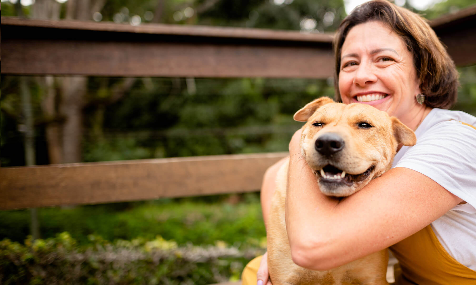 A woman hugging her dog