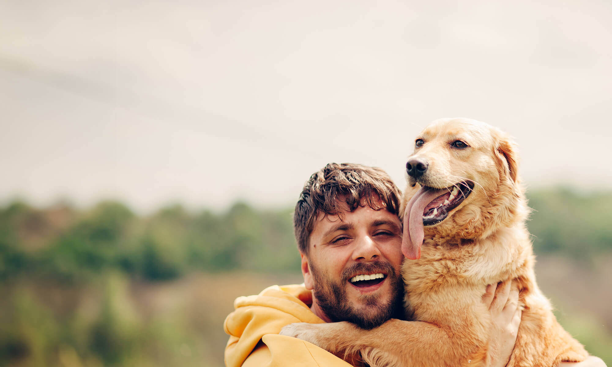 A man with his dog outdoors