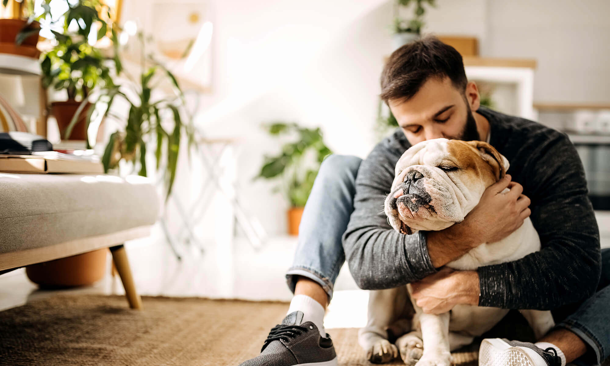 A man hugging his dog